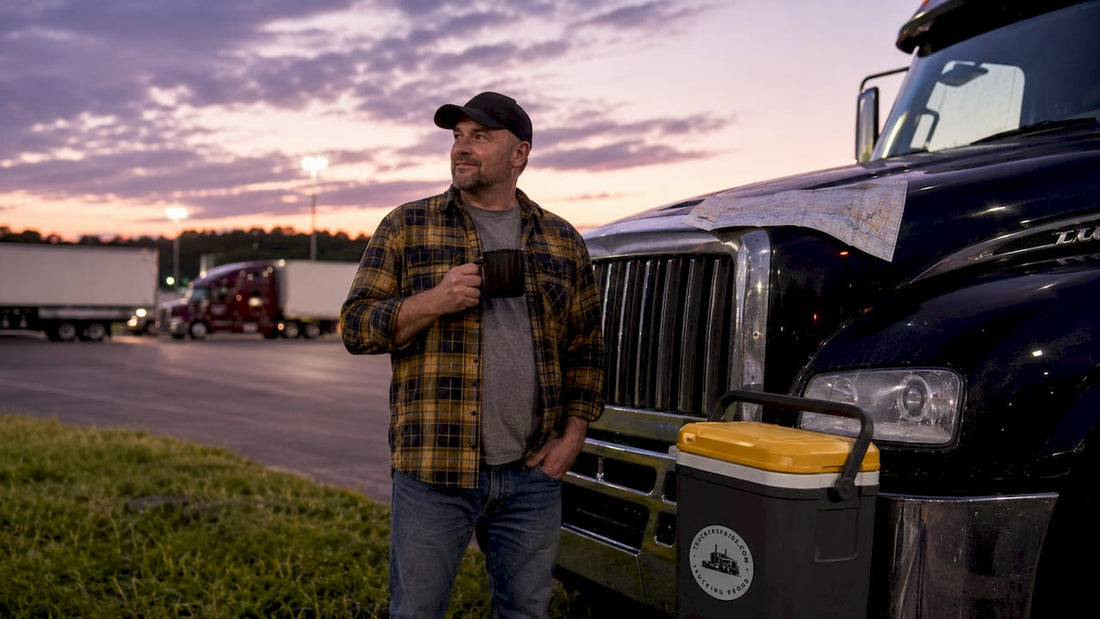 Truck driver in lifestyle clothing by semi-truck
